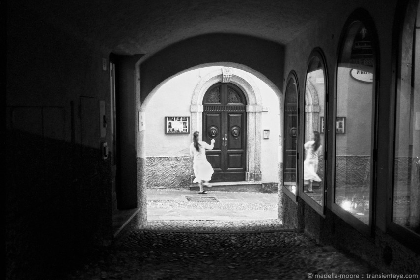Girl in Doorway, Bellagio, Italy. Leica M7 with Zeiss ZM 1.5/50 and Ilford Delta 100 film.